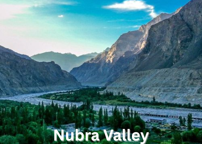 Scenic view of Nubra Valley with sand dunes and snow-covered peaks in Ladakh, India