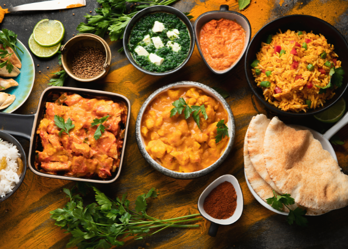 "Indian street food spread with chaat, samosas, dosas in a lively market setting"