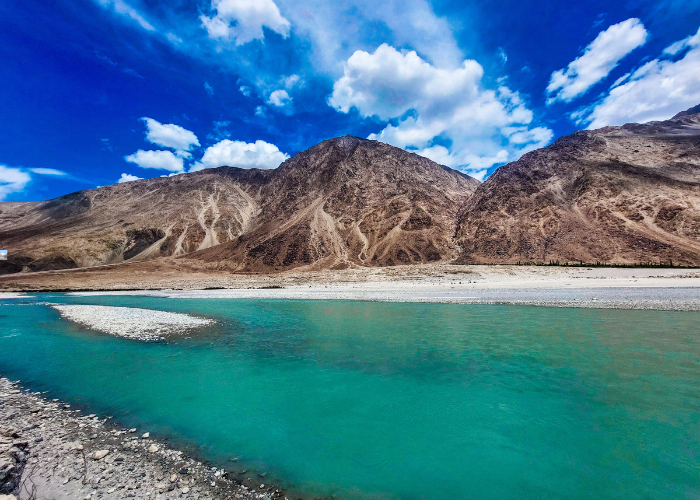 Nubra River Ladakh flowing through green valley and mountains