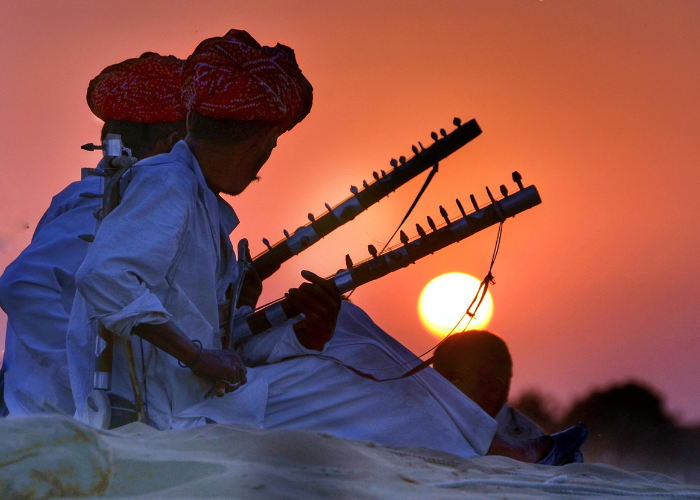 villagers sitting together in a traditional Indian village, representing cultural diversity and community life.