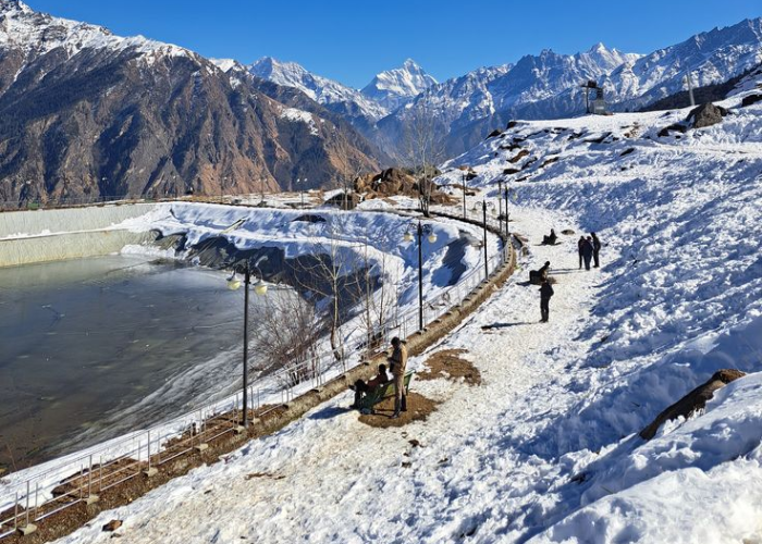 Fresh early snowfall on ski slopes of Auli, Uttarakhand with Nanda Devi peaks in background